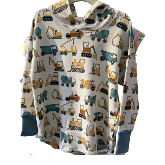 Baby hoodie with construction vehicle pattern on a white background