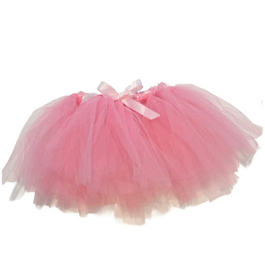 Pink tutu skirt with a bow on a white background